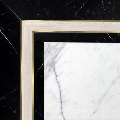 A luxurious mosaic border featuring a combination of black marble, white marble, and brushed brass with gold accents.
