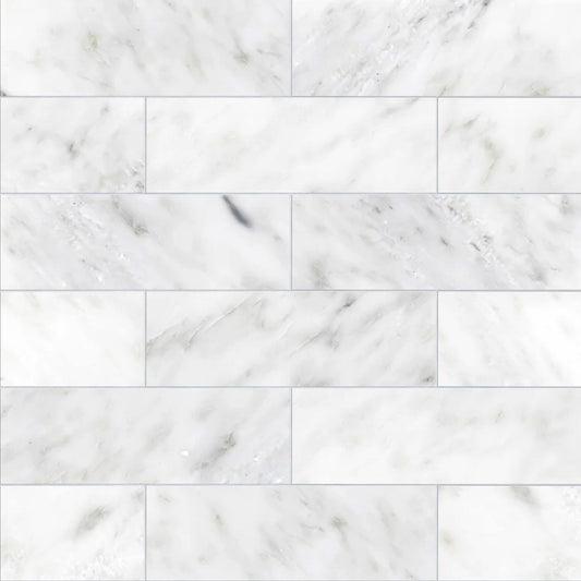White marble tiles with a subtle gray veining pattern.