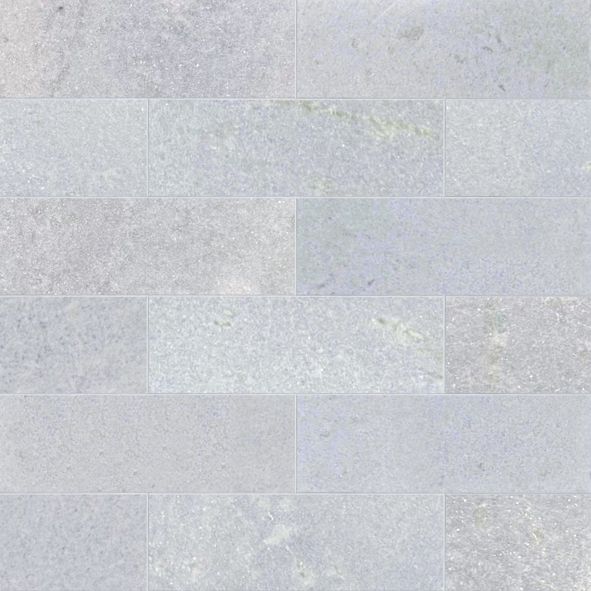 Pattern of light gray tiles with a subtle texture