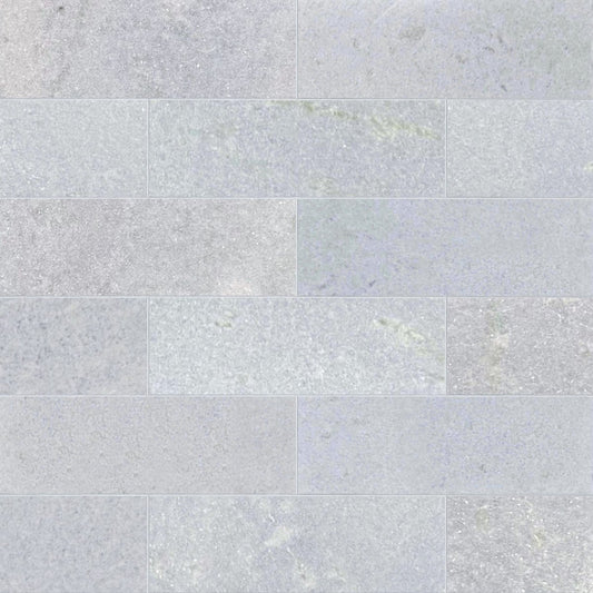 Pattern of light gray tiles with a subtle texture