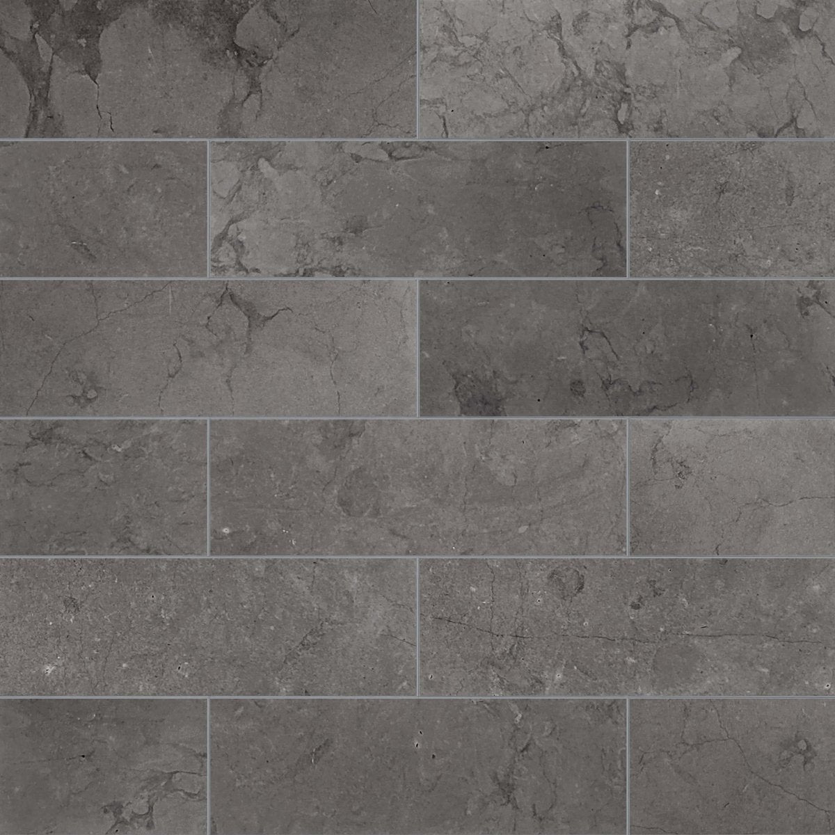 Pattern of dark gray tiles with a textured surface.