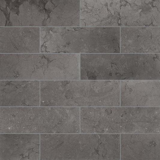 Pattern of dark gray tiles with a textured surface.