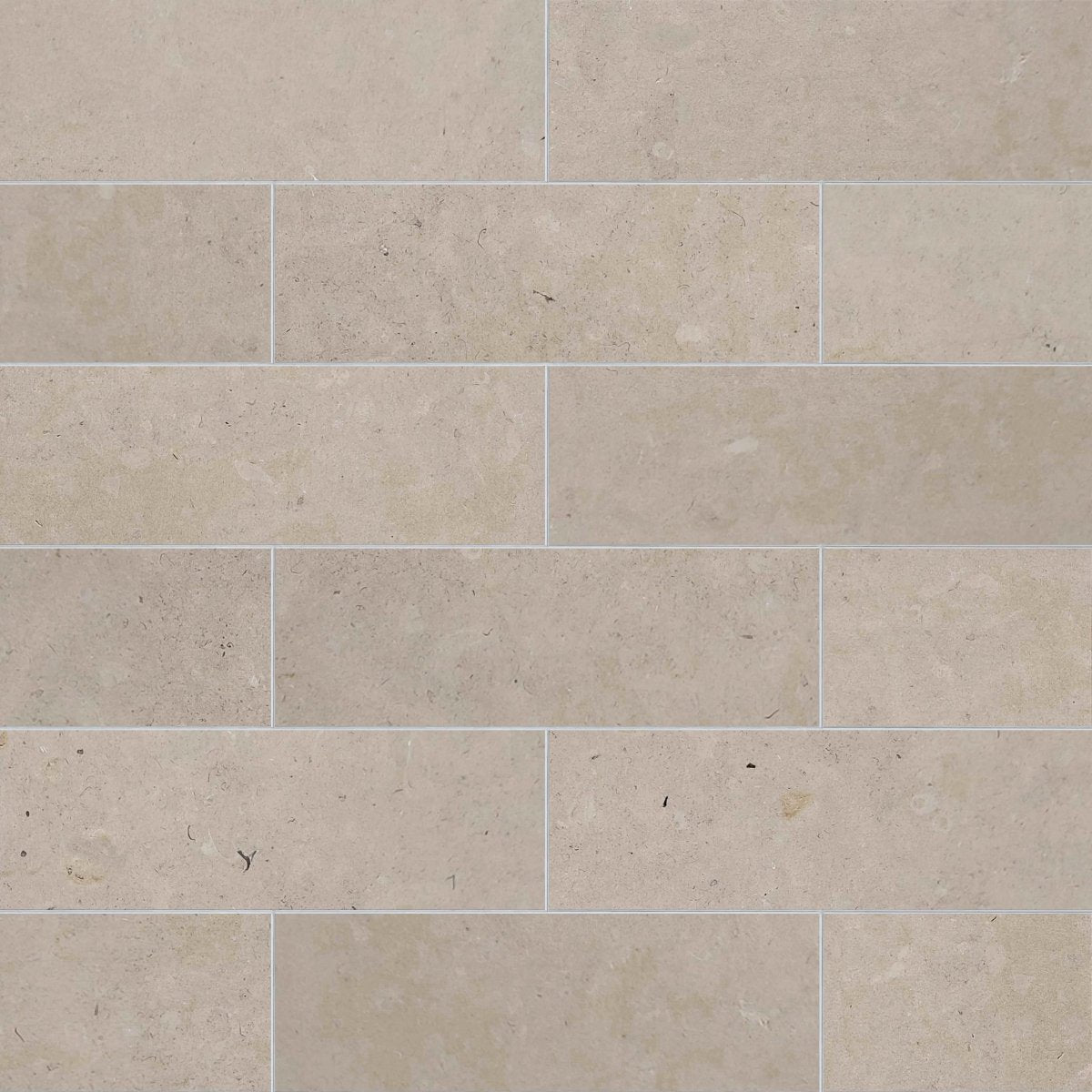 Beige tiles with a subtle pattern on a beige background
