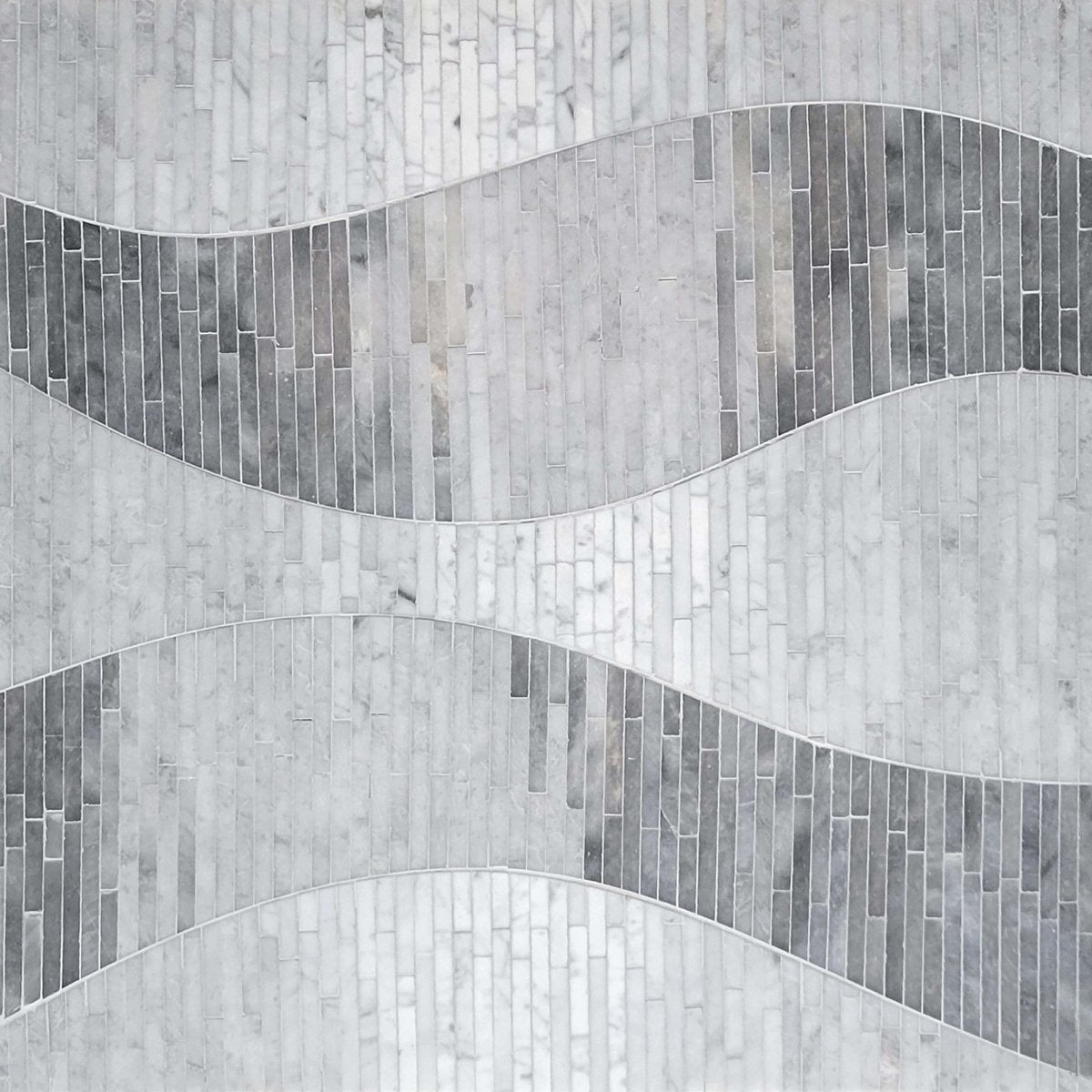 Gray mosaic tile pattern with wavy lines on a textured background