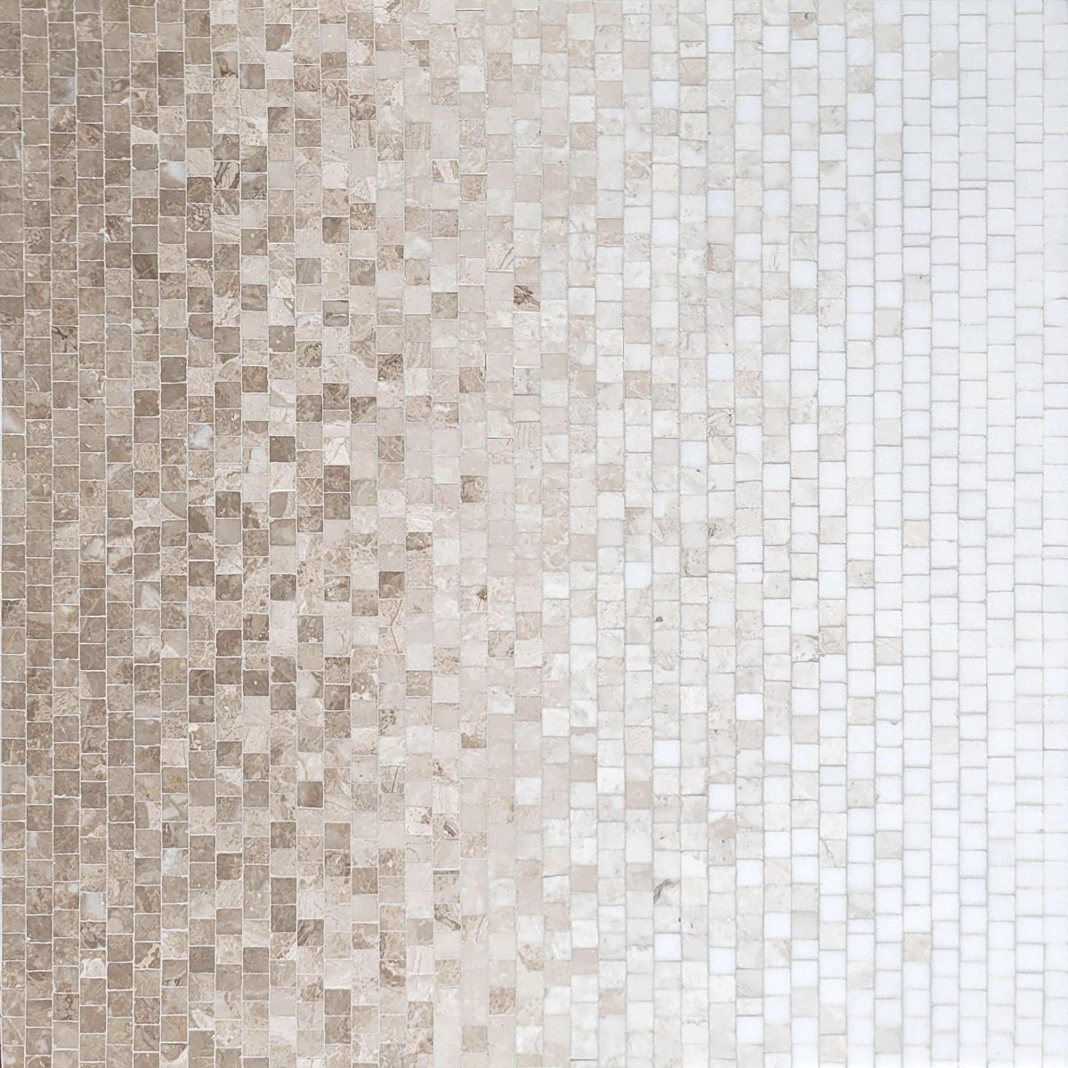 Mosaic tile pattern in beige and white on a white background